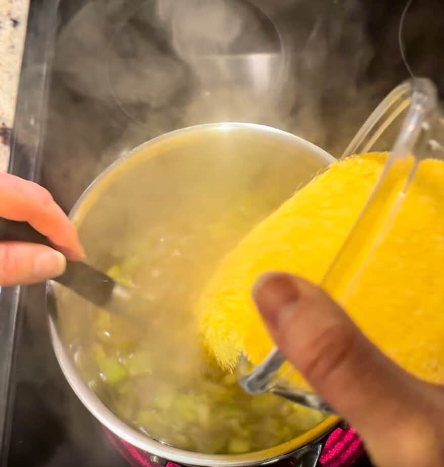 Polenta added to pot.