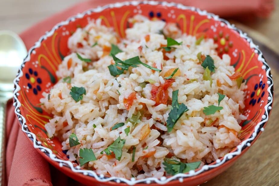 Cooked Mexican  rice in a festive colorful bowl.