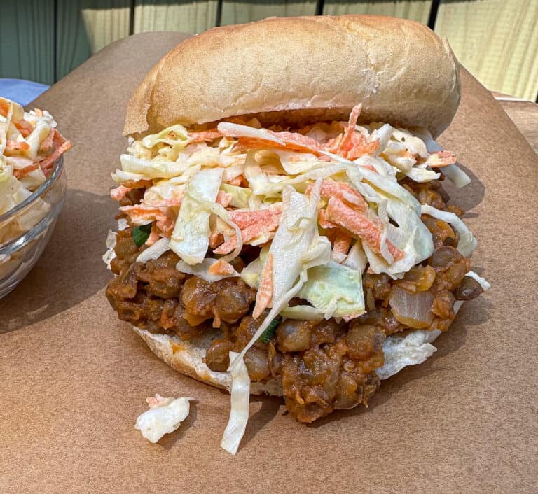 Lentil Sloppy Joe on a bun with Cole slaw on top.