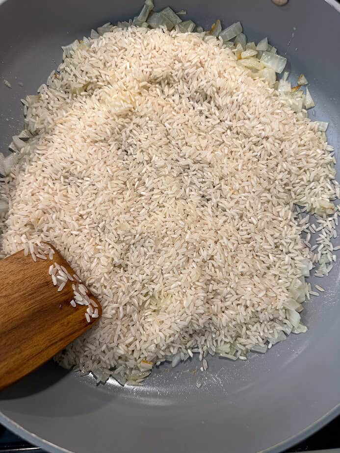 Rice added to pan for risotto.