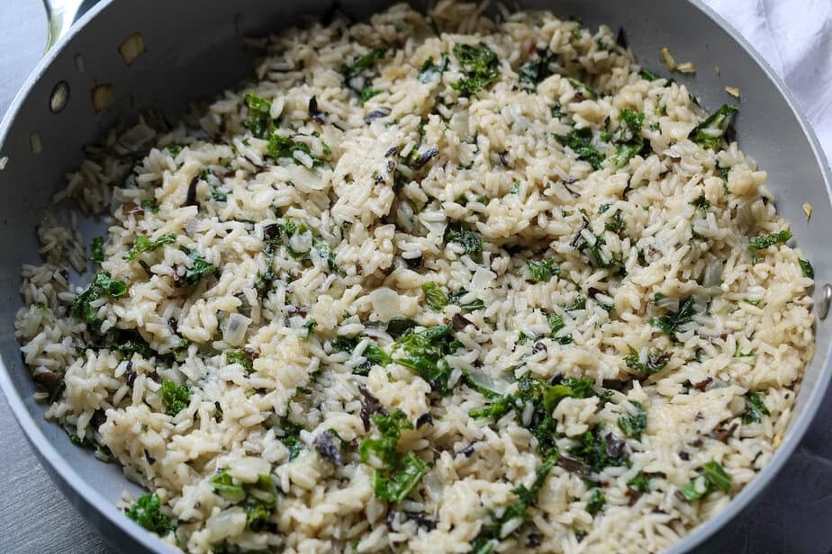Black trumpet risotto cooked in pan.