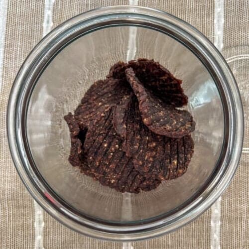 Dehydrated ground beef patties in a glass jar.