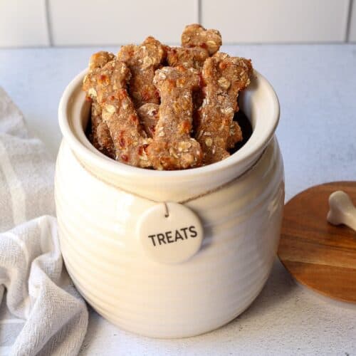 Bacon cheddar dog treats in a treat jar.