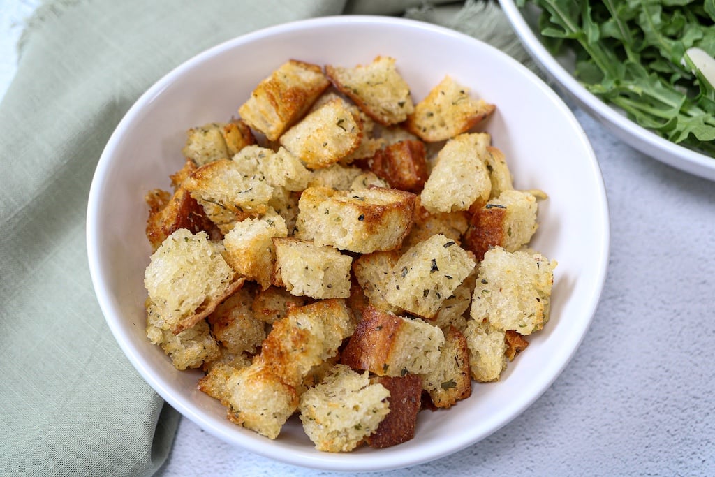 Croutons in a white bowl.