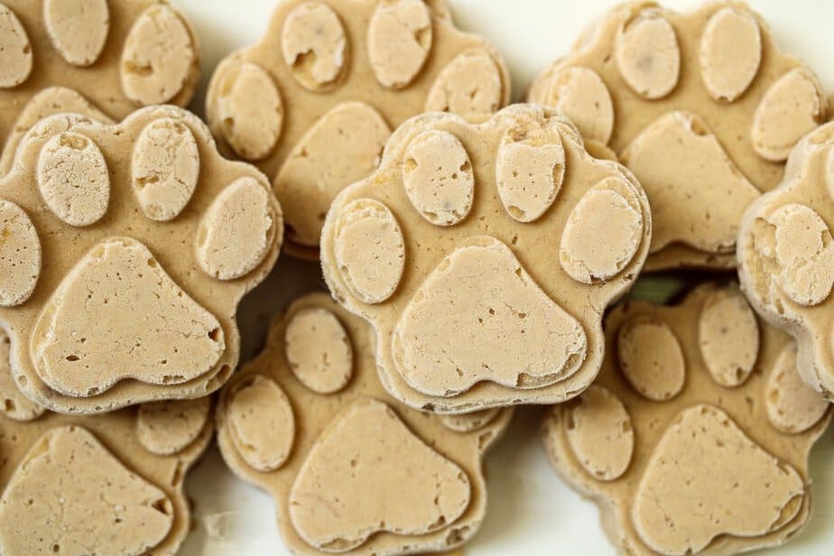 Frozen dog treats in paw shapes.
