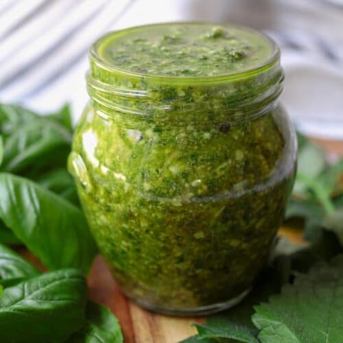 Lemon balm pesto in a clear jar.