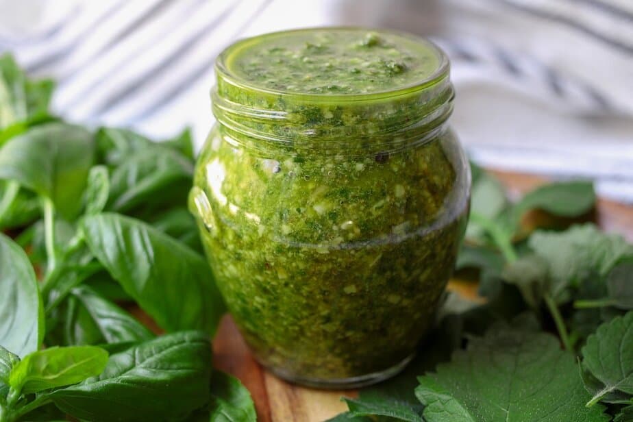 Lemon balm pesto in a clear jar.