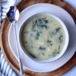 Kale soup in a ceramic bowl.
