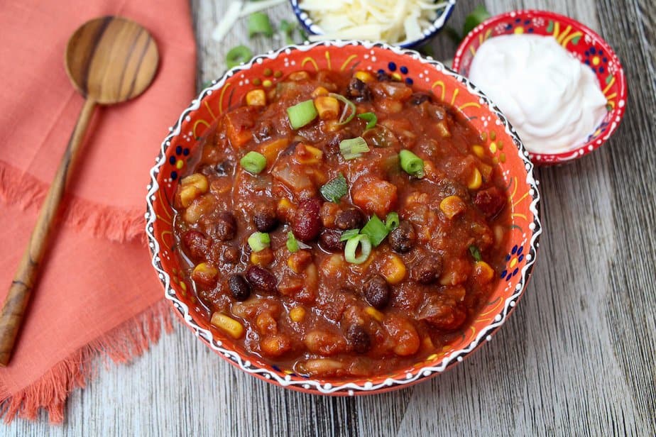 Slow cooker vegetarian chili in a festive bowl.