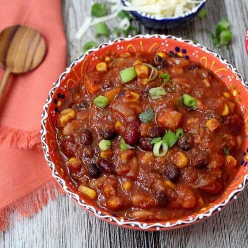 Slow cooker vegetarian chili in a festive bowl.