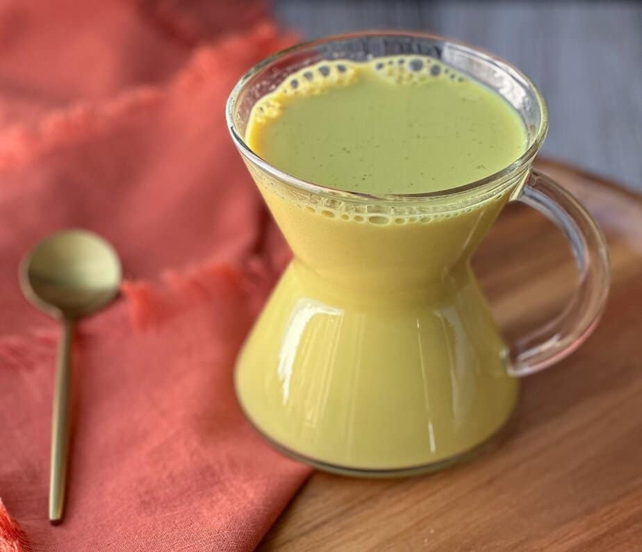 fresh turmeric latte golden milk recipe with ginger and cinnamon.
