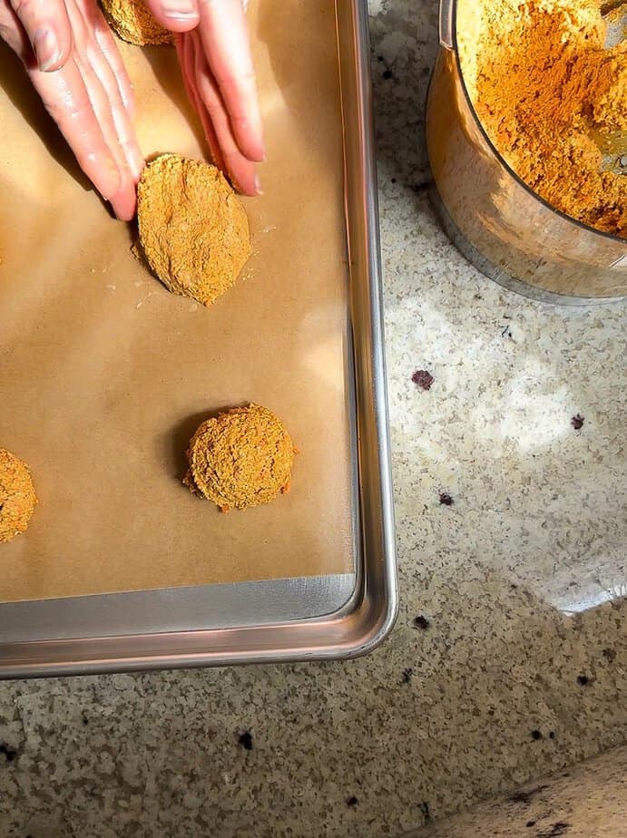 Hand shaping dough into an egg-shape.