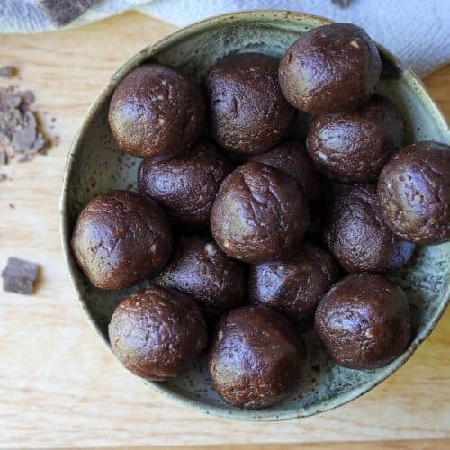 Black bean peanut butter brownie ball treats in a bowl.