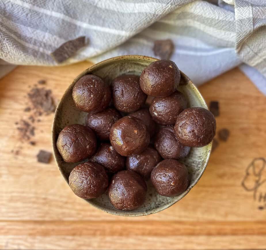 Black bean peanut butter brownie ball treats in a bowl.