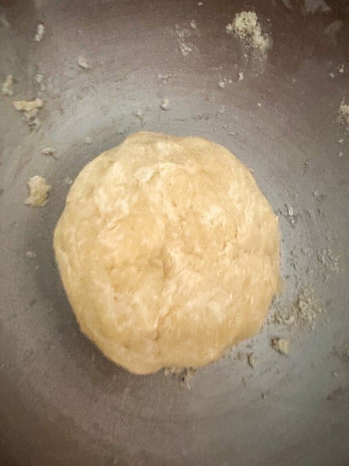 Ball of formed pie crust dough.
