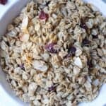 Granola with coconut and cranberries in a bowl.