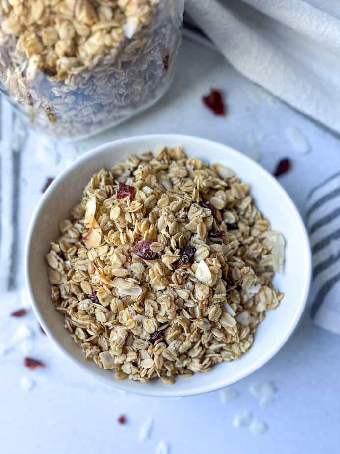 Granola with coconut and cranberries in a bowl.