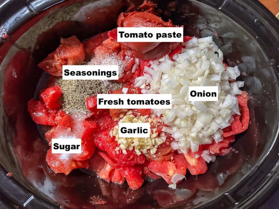 Labeled ingredients in the base of a slow cooker.