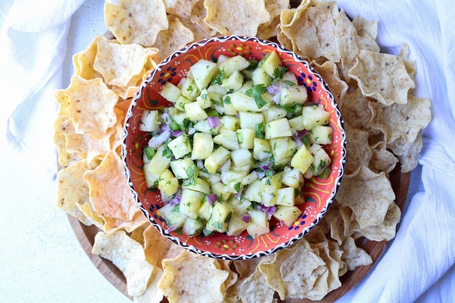 Pineapple Salsa in a festive bowl surround with tortilla chips.