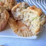 Half of a baked zucchini muffin.