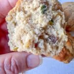 Half of a baked zucchini muffin.