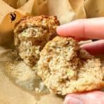 Half of a baked zucchini muffin.